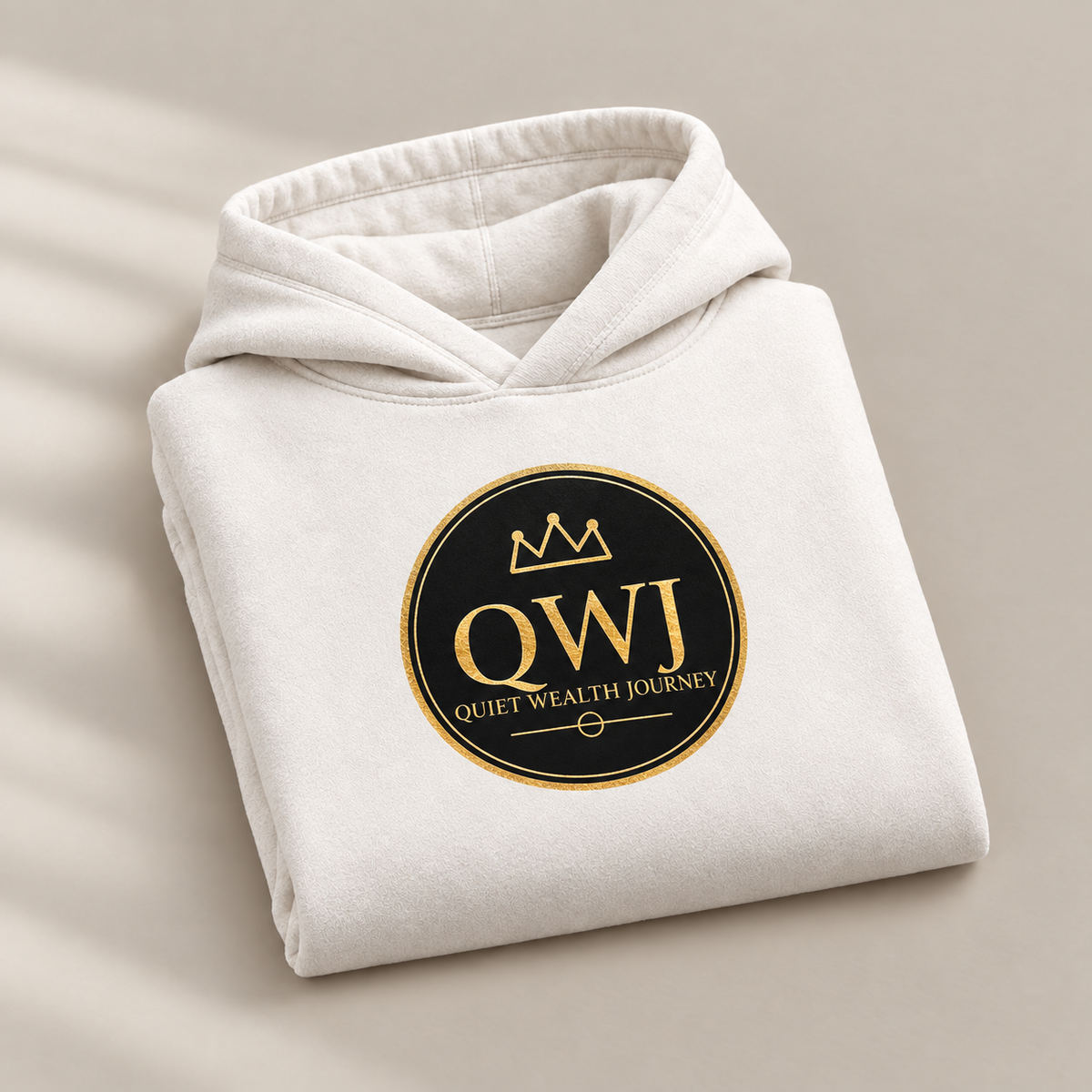 Quiet Wealth Journey logo hoodie – folded view