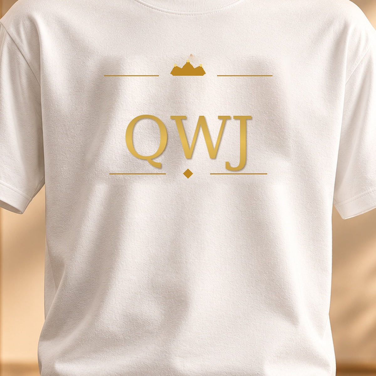 QWJ GOLD CROWN MONOGRAM tee — premium luxury design detail
