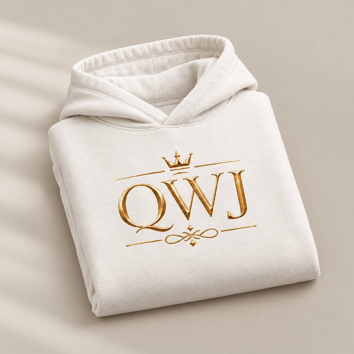 QWJ Gold Monogram affirmation hoodie – folded view
